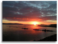The sun setting over Galway Bay near Galway City in County Galway Ireland